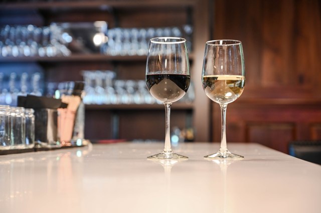 This is a photo of two wine glasses on the new white bar top at The Federal Restaurant.